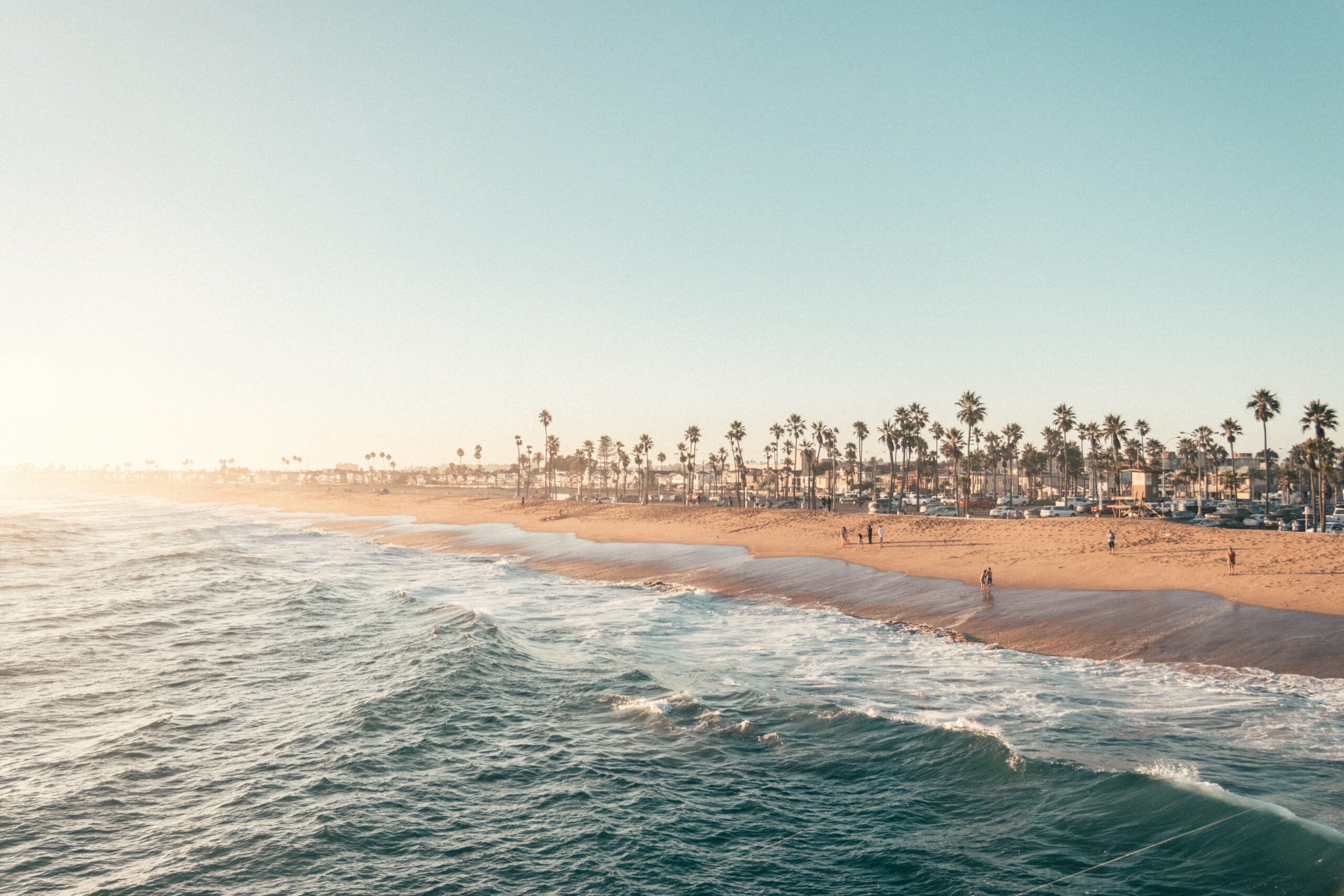 People enjoying the sandy shores under the daytime sun