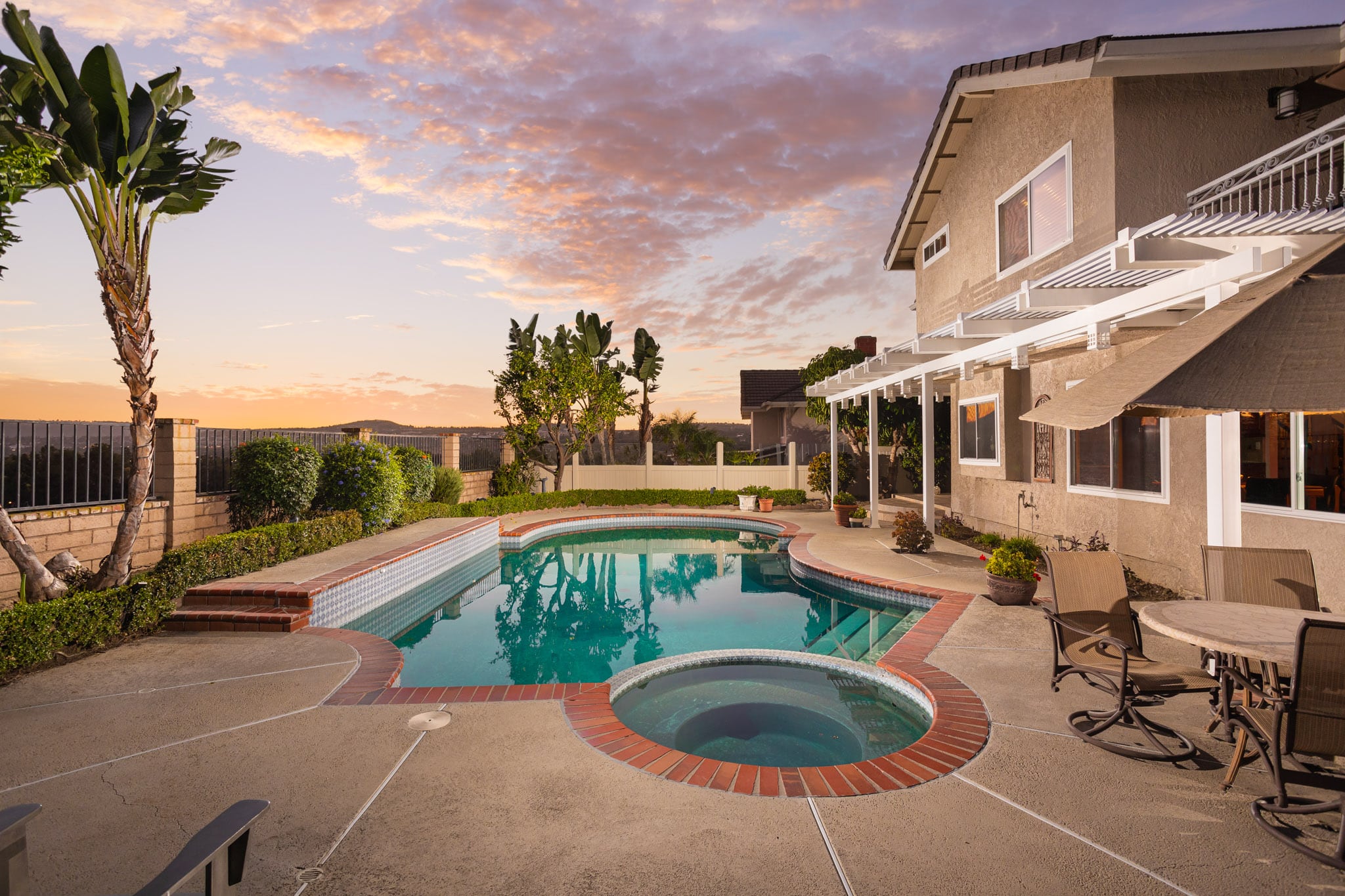 Exterior living space with pool and other renovations.