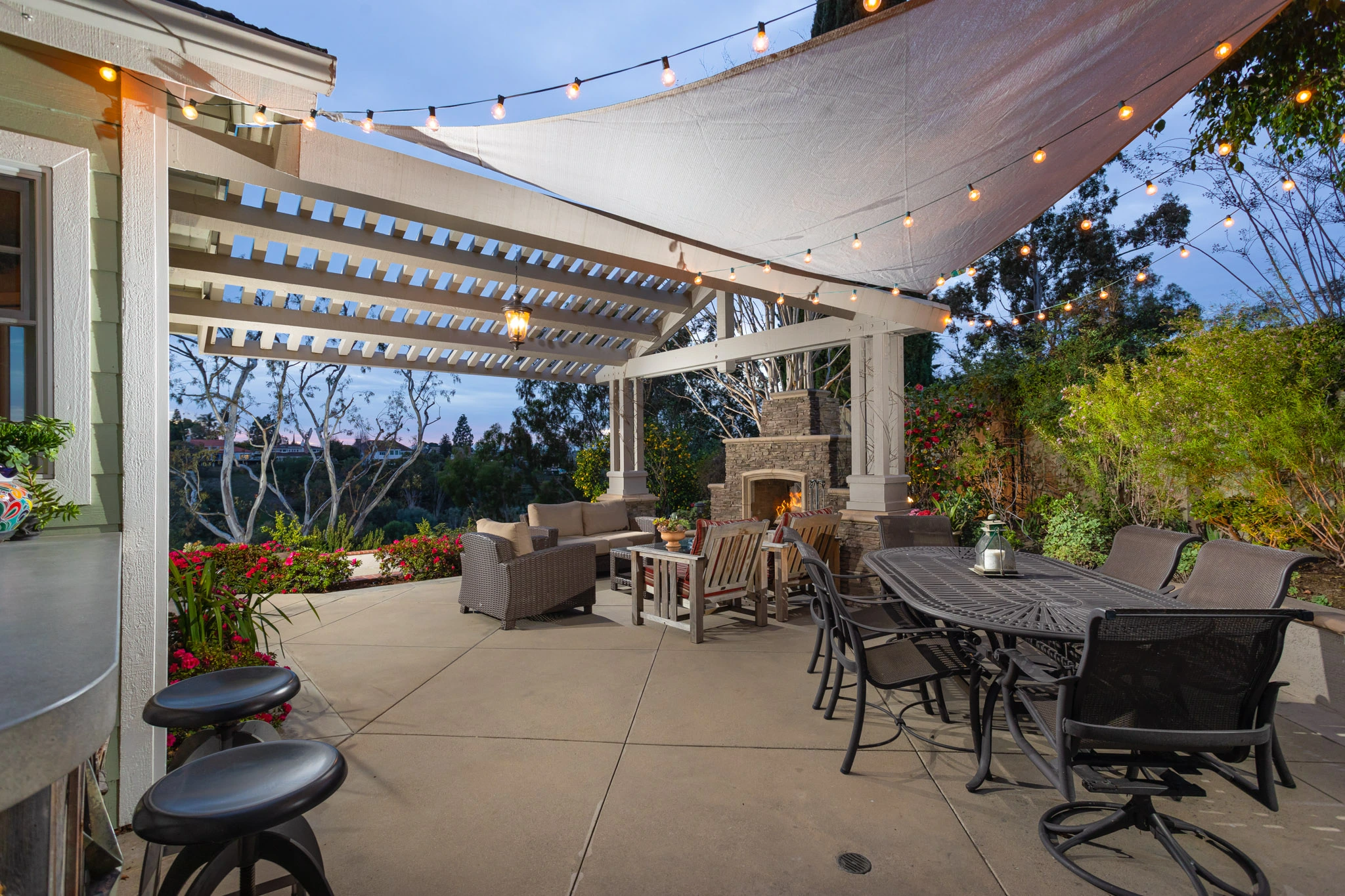 Elegant backyard fireplace and patio in an Orange County home, symbolizing warmth and the competitive spirit of the 2024 housing market.