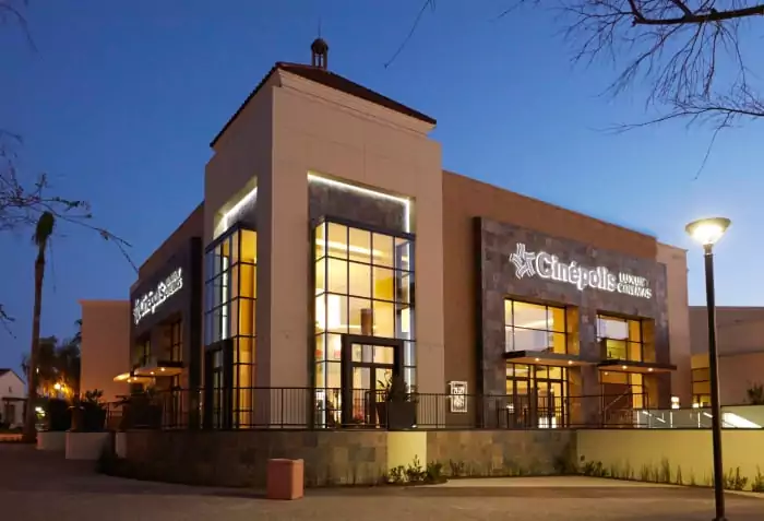 Nighttime Exterior View of Cinepolis Luxury Cinemas with Large Windows