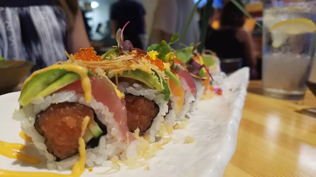 Sushi Roll with Raw Fish, Avocado, Microgreens, Caviar Roe, and Spicy Mayo at Yamame