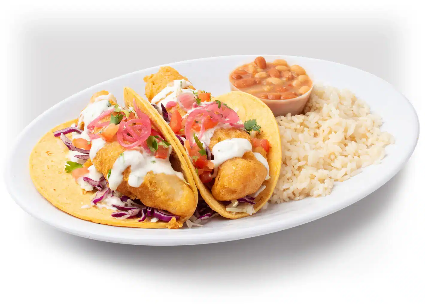 Two Fried Fish Tacos in Small Flour Tortillas topped with cabbage, white sauce, pickled red onion slices, and cilantro with a side of Rice and Beans