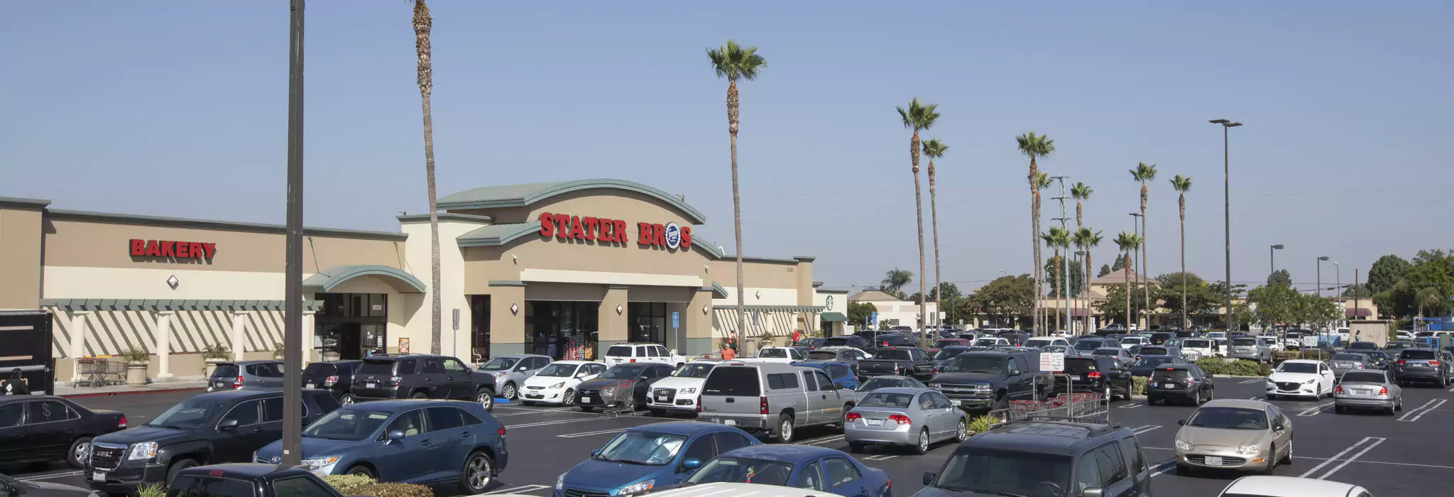 Picture of packed Parking Lot of cars outside Stater Bros Grocery Store at the Cypress East Shopping Center