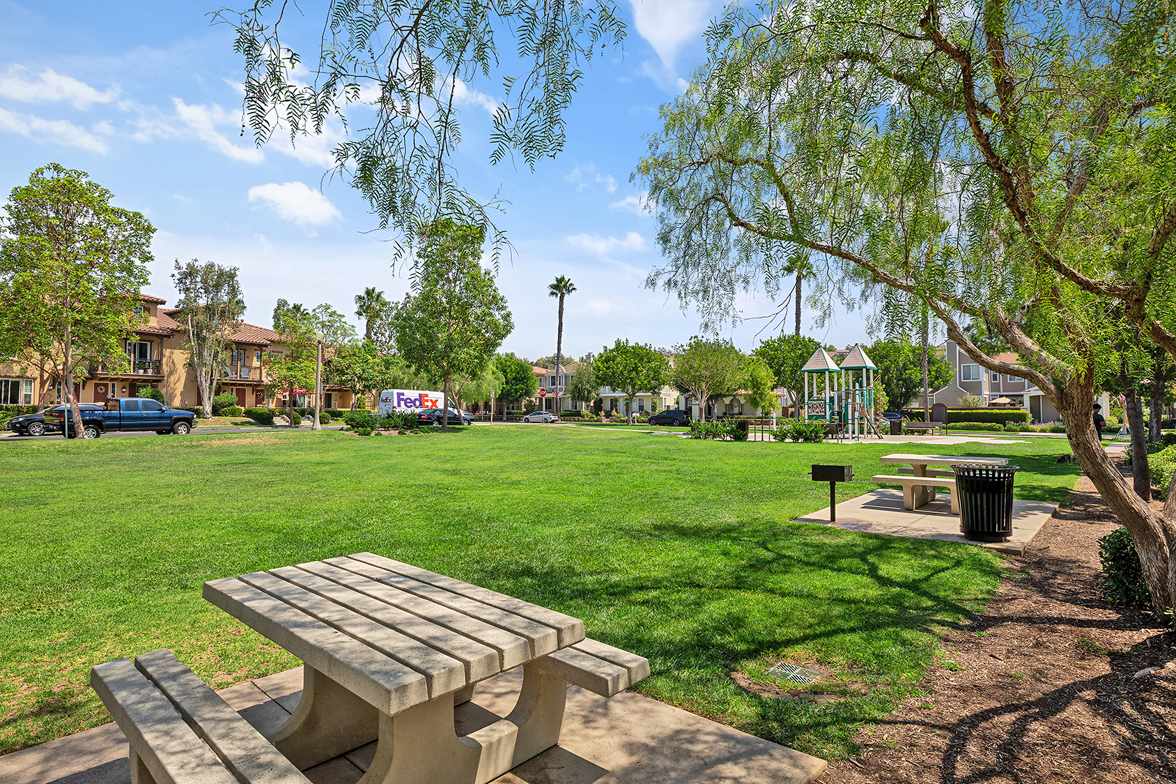 View of a park with play structure and homes in Ladera Ranch, CA