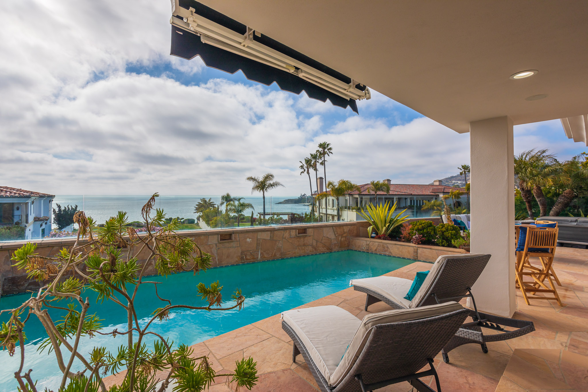 Dana Point luxury home backyard with infinity pool overlooking the ocean