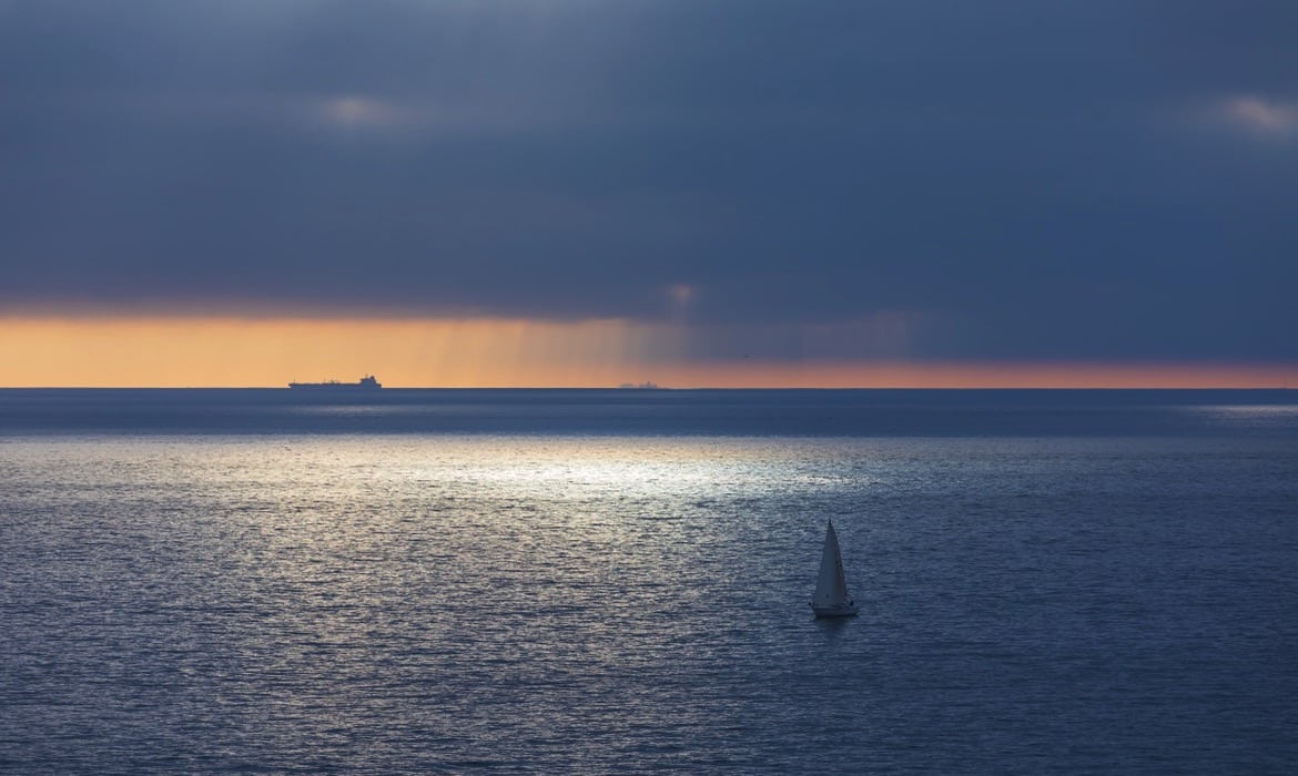 Sunset view of boats in the water at Dana Point Harbor