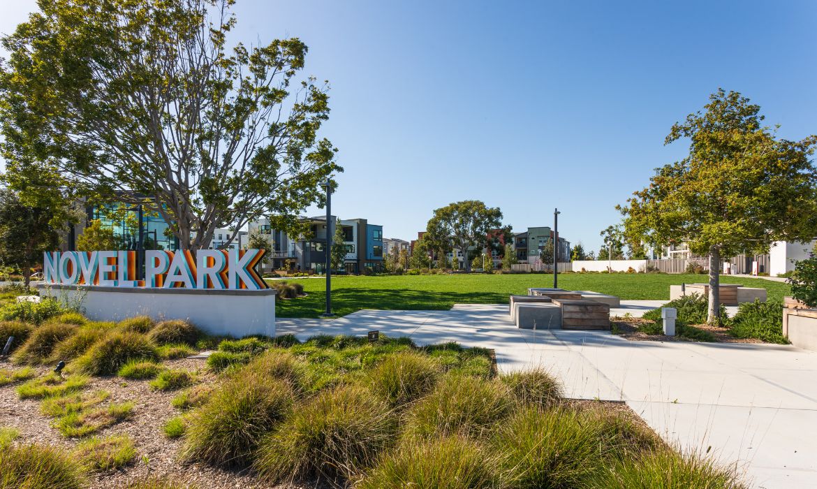 Novel Park community sign surrounded by attractive townhomes in the Great Park area of Irvine