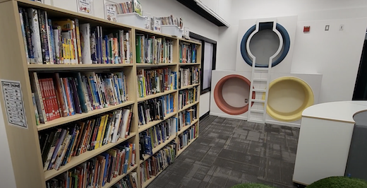 School library with bookshelves filled with books and reading nooks at Beechwood School