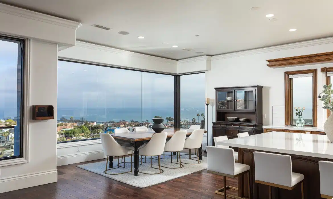 Dining room with panoramic ocean views in Lantern District luxury home sold by Brad Feldman Group