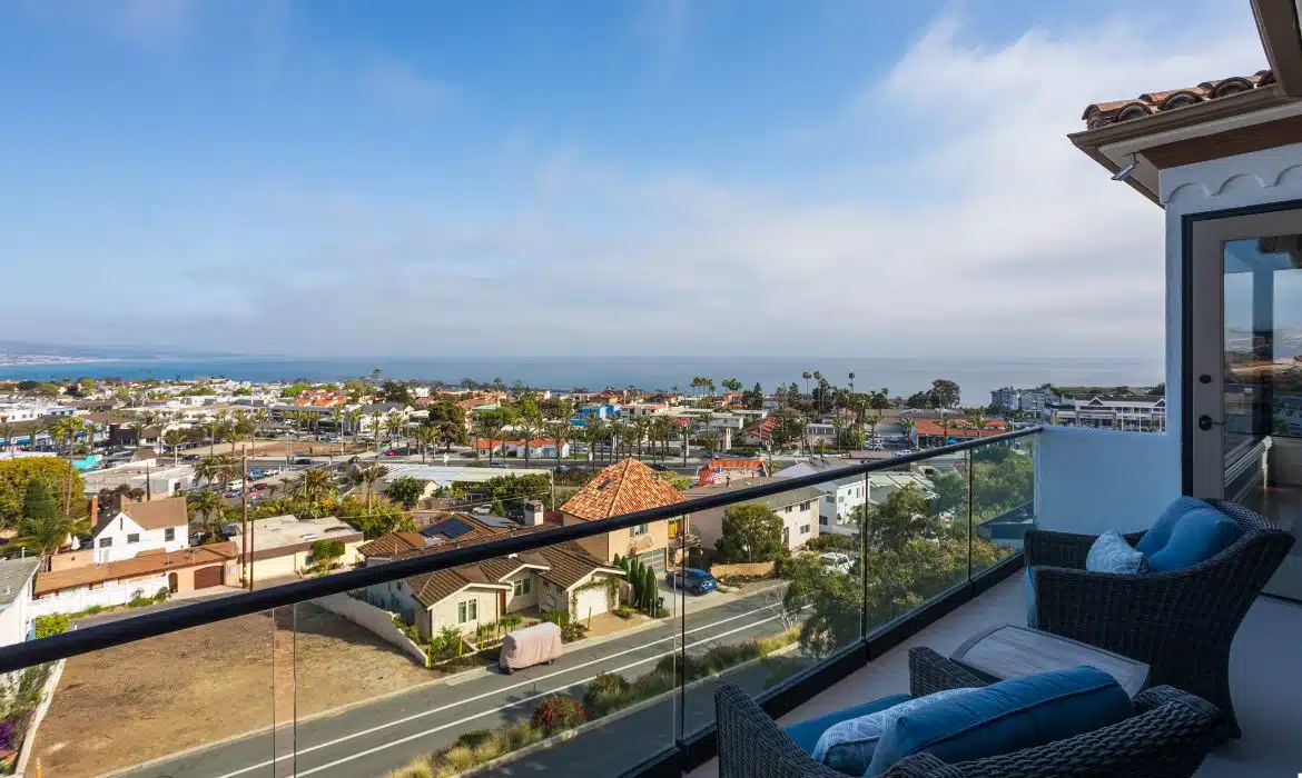 Balcony overlooking the Pacific Ocean and Lantern District in Dana Point luxury listing