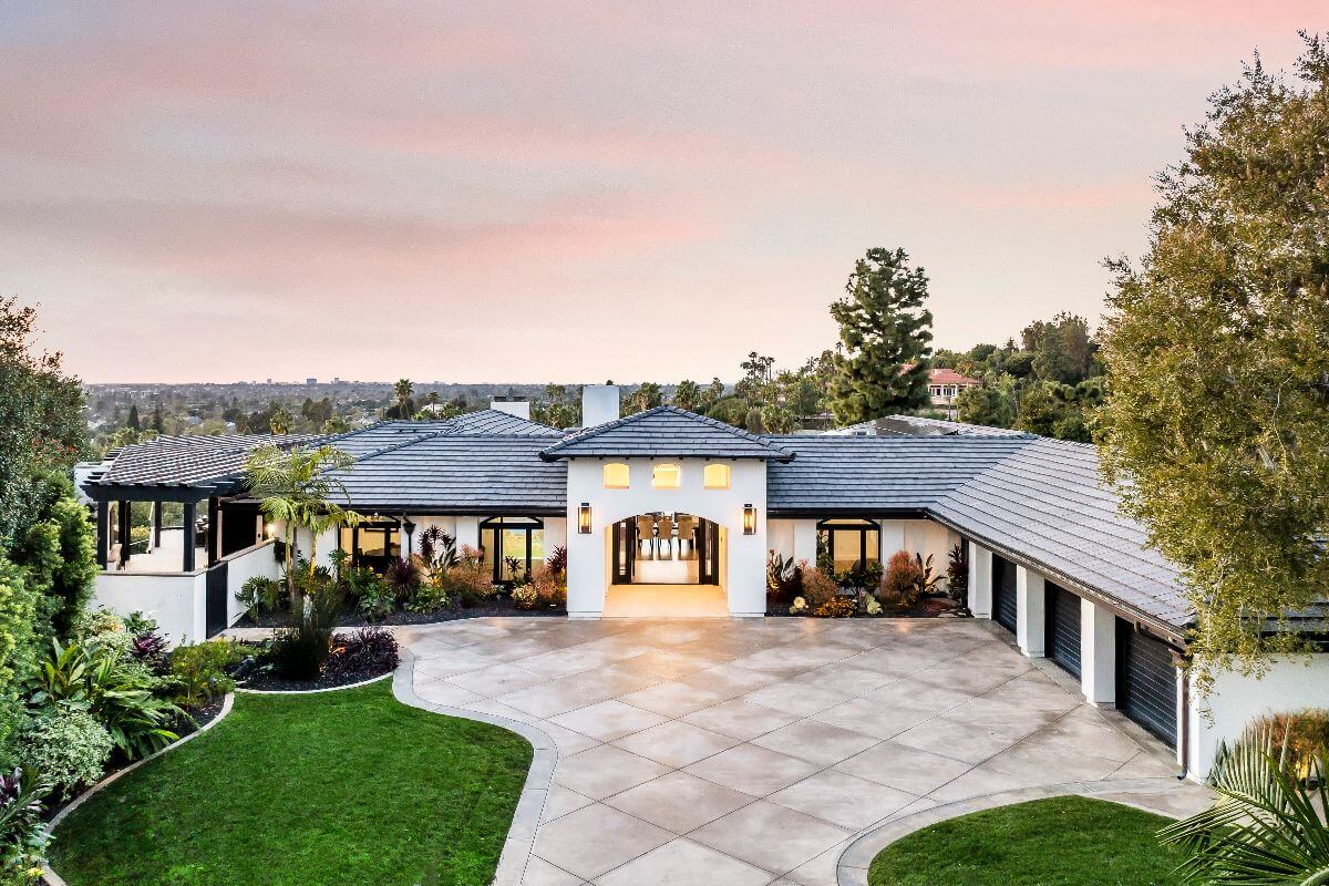 wide front photo of North Tustin luxury estate at 11821 Highview Dr, with classic tile roof and huge views, represented by top listing agents the Brad Feldman Group