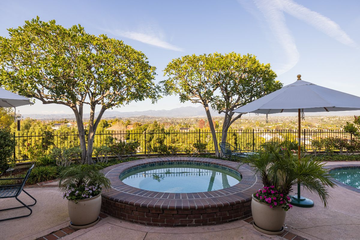 Jacuzzi spa in backyard of Laguna Hills real estate listing with huge rolling hill views, sold by best Realtors in Orange County