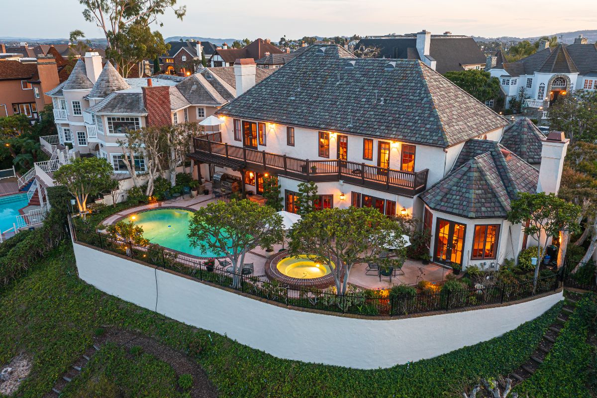 Aerial view of Laguna Hills luxury home backyard with pool and spa resort style retreat, listed and sold by top realtors the Brad Feldman Group