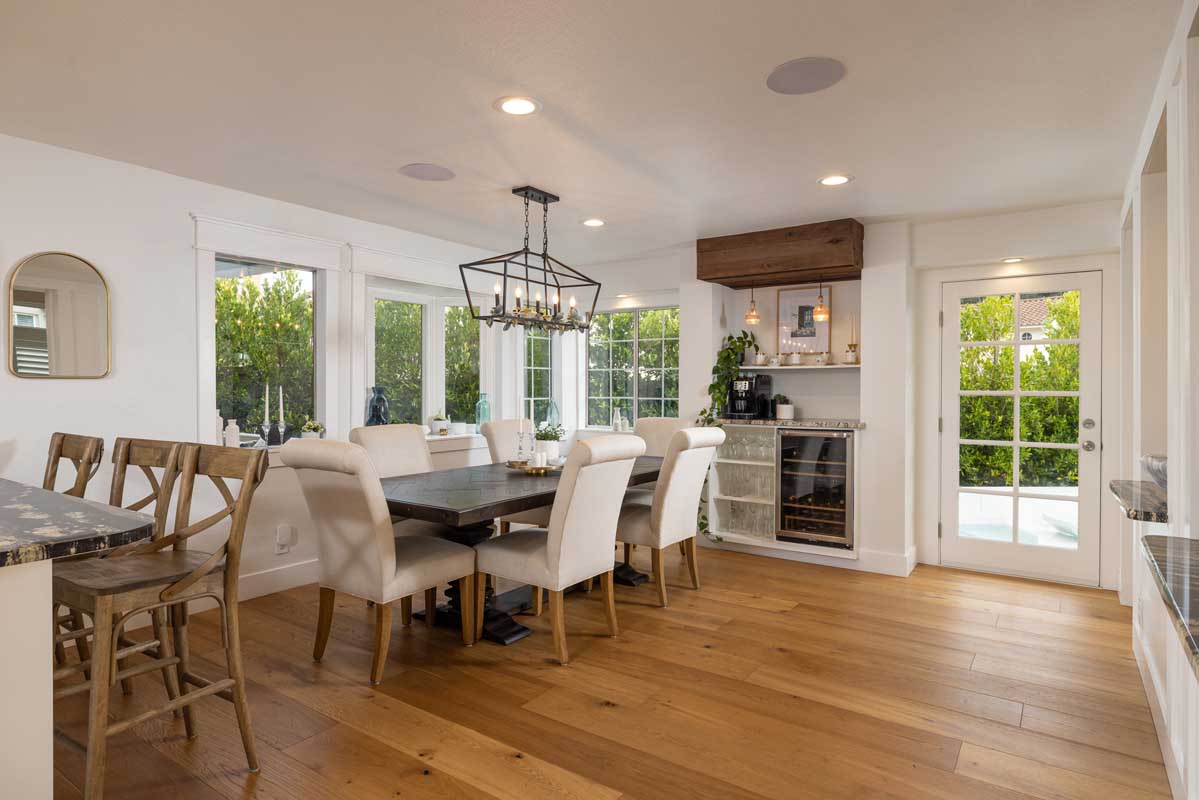 Luxurious dining area with chandelier and wine fridge in the Laguna Niguel home sold by top Realtors Brad Feldman Group