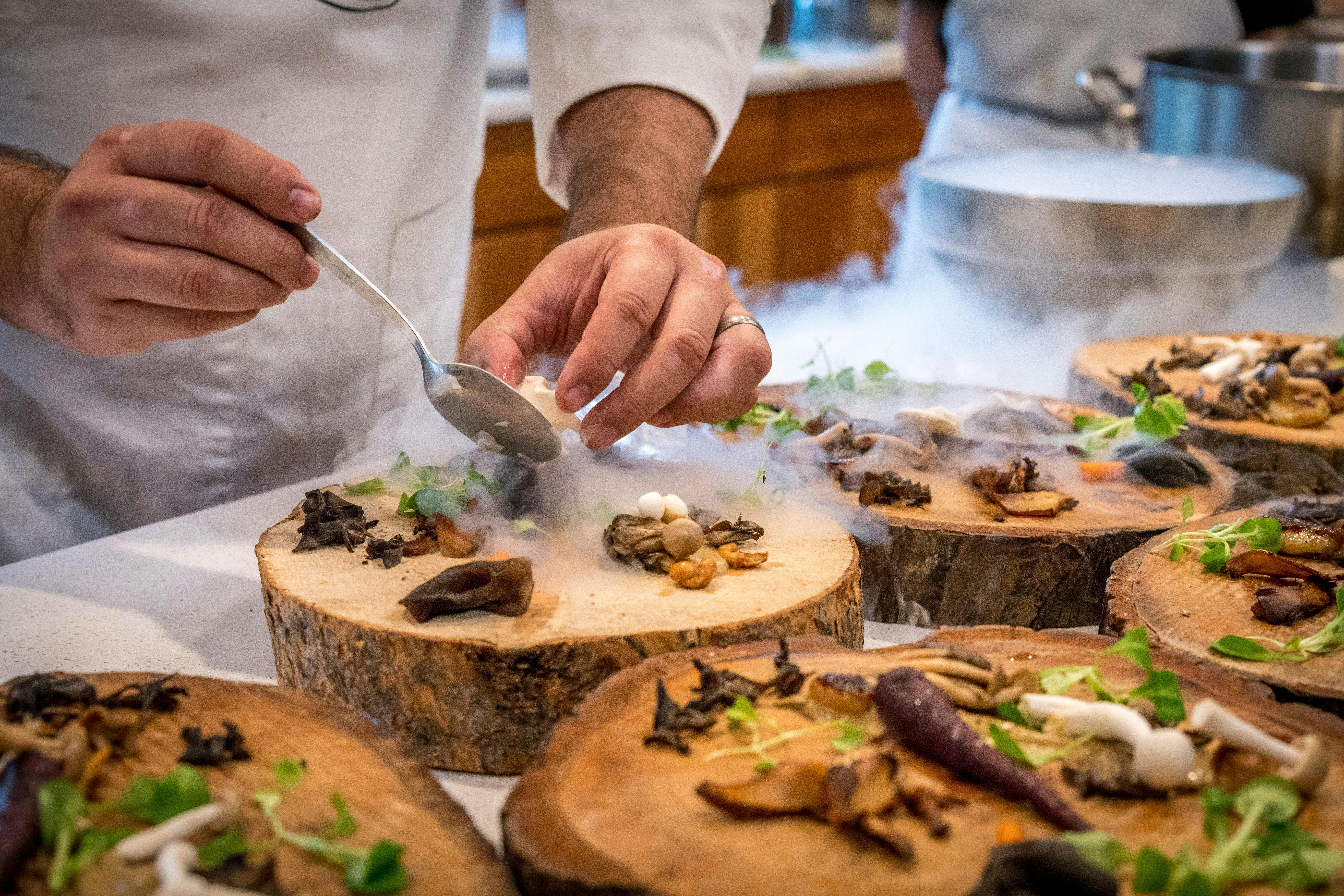 Fine dining with chef serving food at an upscale Monarch Beach Dana Point restaurant