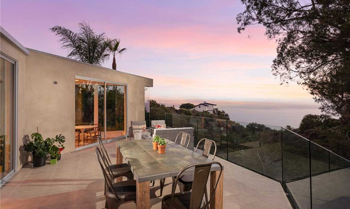 Laguna Beach home for sale real estate listing at sunset with ocean views, sold by top local Realtor agents Brad Feldman Group