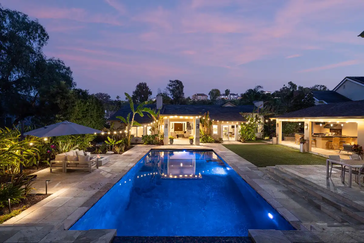 Outdoor living area with luxury pool and patio of Nellie Gail Ranch real estate home sold by top local Realtor agents