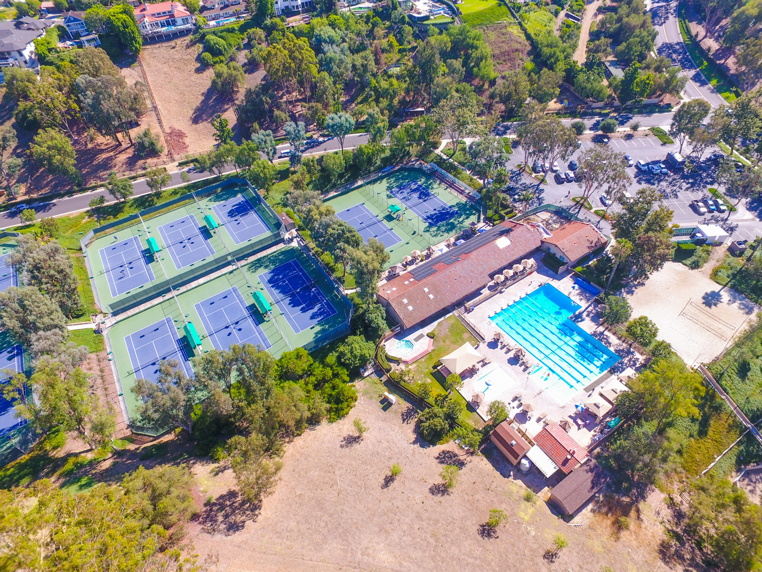 Aerial photo of amenities, pickleball/tennis, pool, and equestrian facilities for horses and homebuyers in Nellie Gail Ranch, Laguna Hills real estate homes for sale