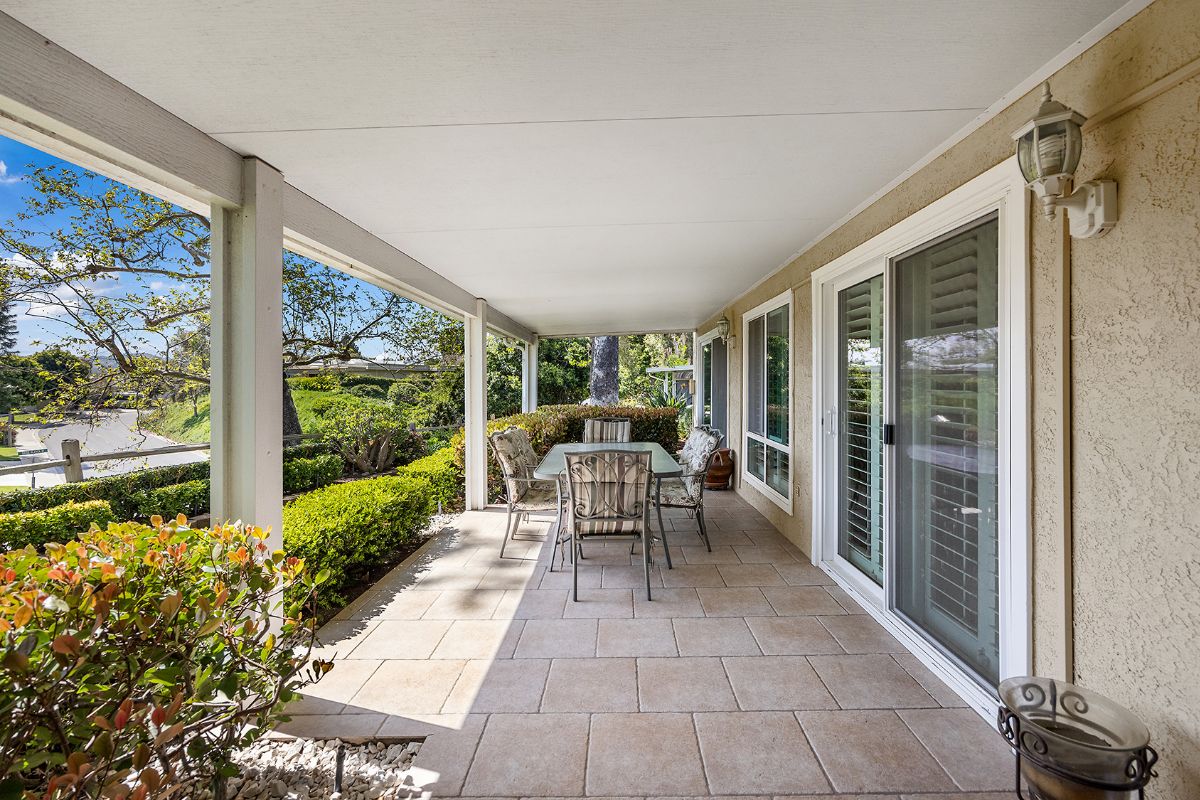 Outdoor living area covered patio with dining set to sell your Laguna Woods home