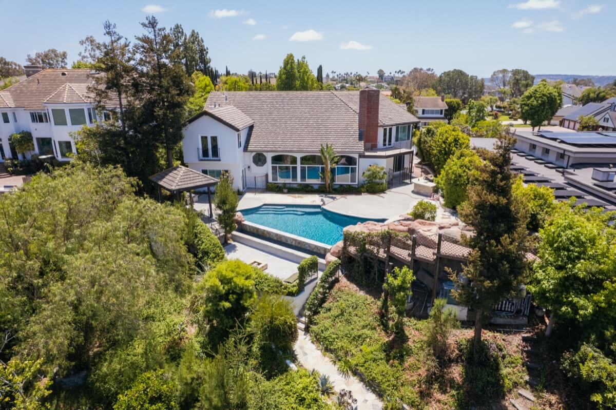 Aerial view of backyard and pool of luxury home sold in Laguna Hills by the best local realtor agent team, the Brad Feldman Group